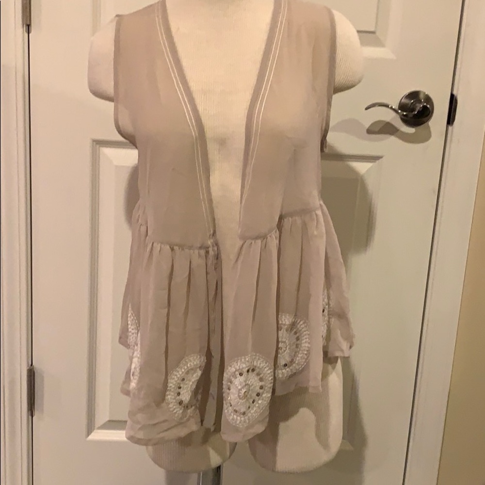 Taupe vest with white embroidery